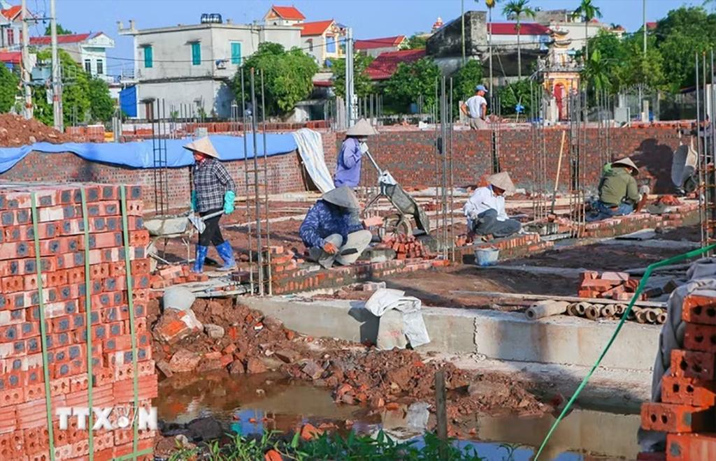 Các chuyên gia nhận xét so với Luật Xây dựng 2014, các quy định mới được đánh giá rõ ràng hơn, giúp giảm tình trạng mỗi địa phương hiểu và áp dụng khác nhau. (Ảnh: Công Luật/TTXVN)
