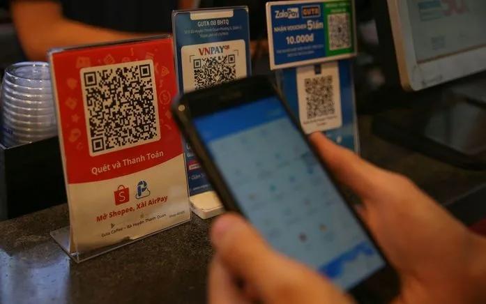 Khách hàng thanh toán hàng hóa bằng ví điện tử. (Ảnh minh họa - Ảnh: NLĐ)